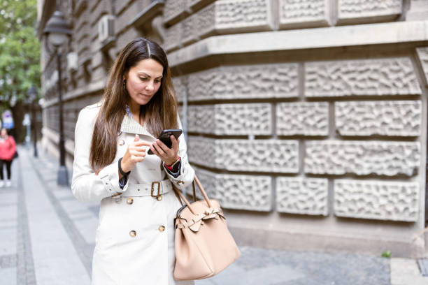 istock Urban Professional Woman Checking Smartphone 2177133672