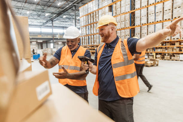 istock Two middle aged multi ethnic male warehouse workers during the daily duties on site 2177133792