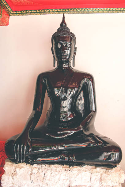 Black Buddha statue in Bangkok, Thailand. Thai sitting Buddha statue