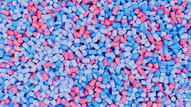istock Closeup top view of colorful mixed plastic polypropylene granules, masterbatch polymer grain. HDPE or PVC resin pellets. 3d render illustration 2177135076