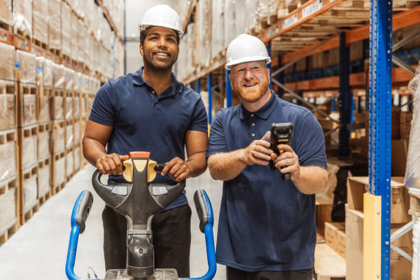 istock Two middle aged multi ethnic male warehouse workers during the daily duties on site 2177135480
