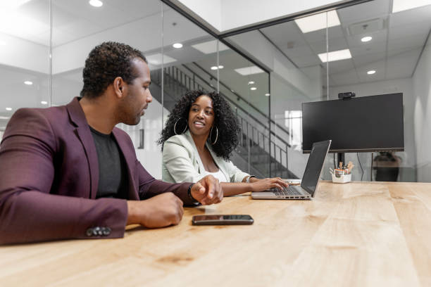 istock Two colleagues talking during an office work meeting 2177135756