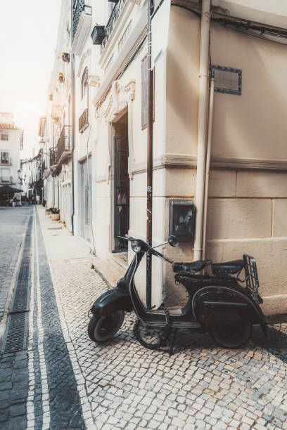 istock Vintage scooter, cobblestone street 2177138985