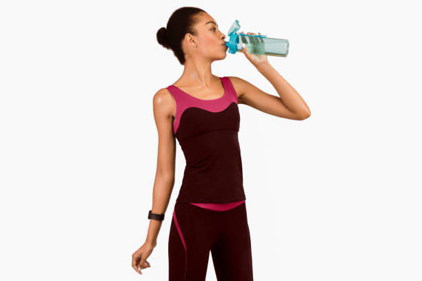 istock Afro Lady Drinking Water From Bottle Standing, Studio Shot, Isolated 2177139997
