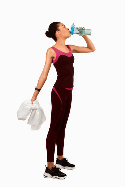 istock Slim Lady In Fitwear Drinking Water Over White Studio Background 2177140008