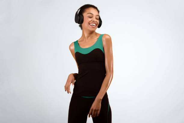 istock Happy Afro Girl In Headphones Dancing In Studio 2177140018