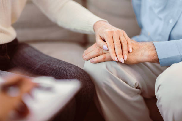 istock Unrecognizable elderly couple holding hands at doctor 2177141184