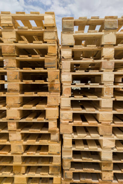 istock Stacked european stringer pallets. Wooden flat structure which supports goods 2177144945