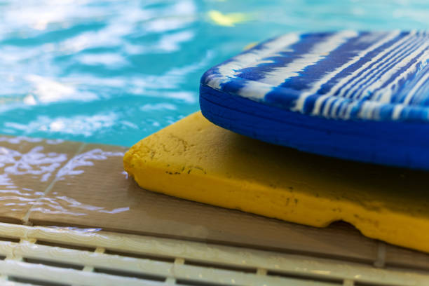 istock Swimming Pool with Stacked Blue and Yellow Kickboards 2177146782