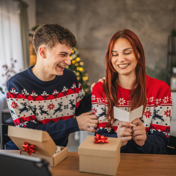 istock Young couple read greeting card during video call on digital tablet 2177147749