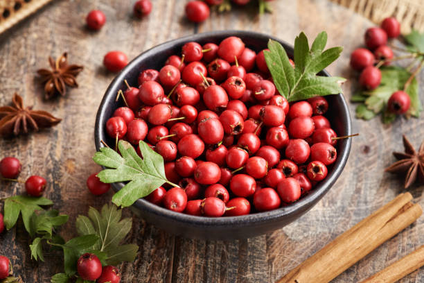 istock Fresh hawthorn berries harvested in autumn in a bowl on a table 2177149224
