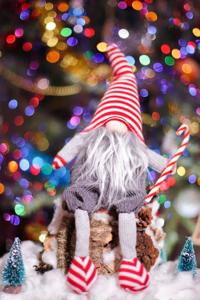 Scandinavian gnome figurines displayed at a festive Christmas market stall.