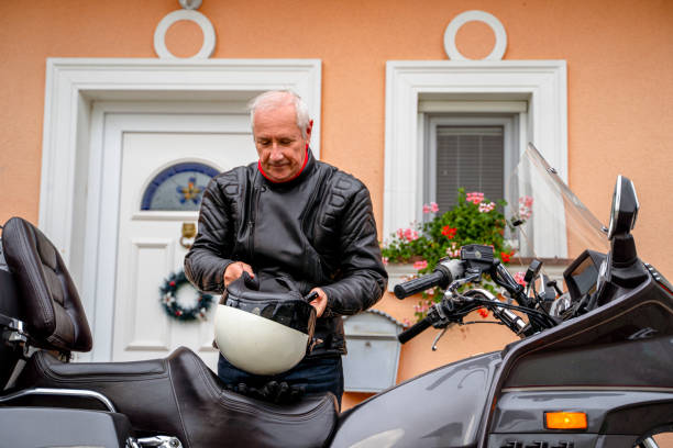 istock Elderly Man Preparing Motorcycle in Front of House 2177154285