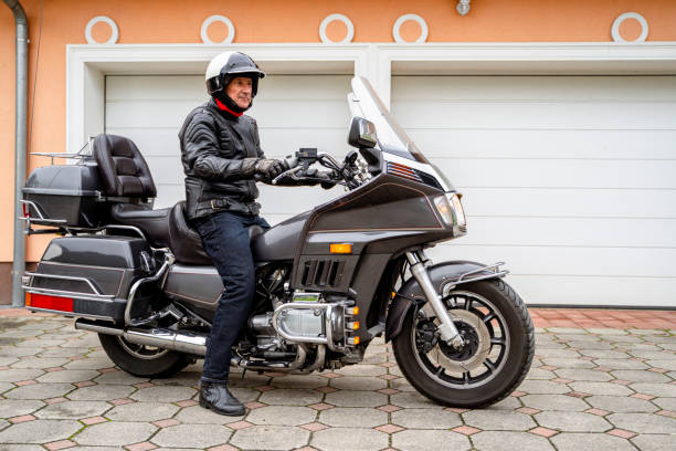 istock Motorcycle Rider in Front of Garage 2177154296