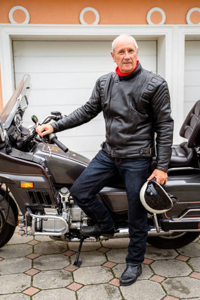istock Man posing with Motorcycle in Front of Garage 2177154300