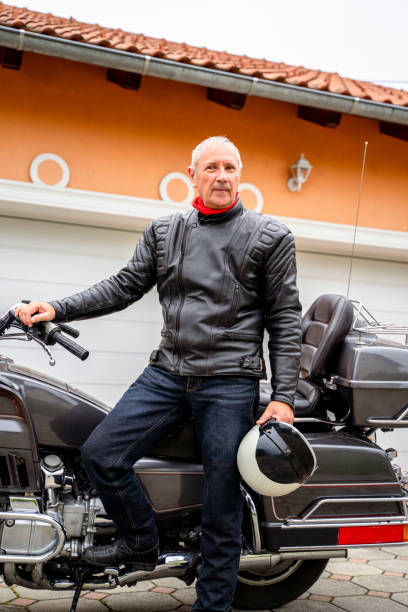 istock Man posing with Motorcycle in Front of Garage 2177154304