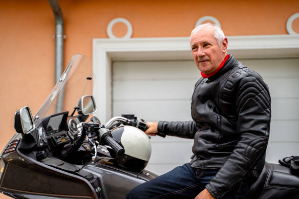 istock Man posing with Motorcycle in Front of Garage 2177154307