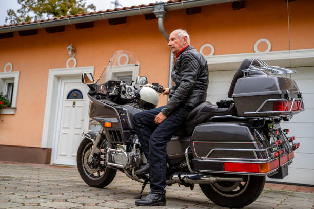 istock Man posing with Motorcycle in Front of Garage 2177154308