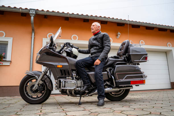 istock Man posing with Motorcycle in Front of Garage 2177154314