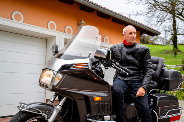 istock Man posing with Motorcycle in Front of Garage 2177154328