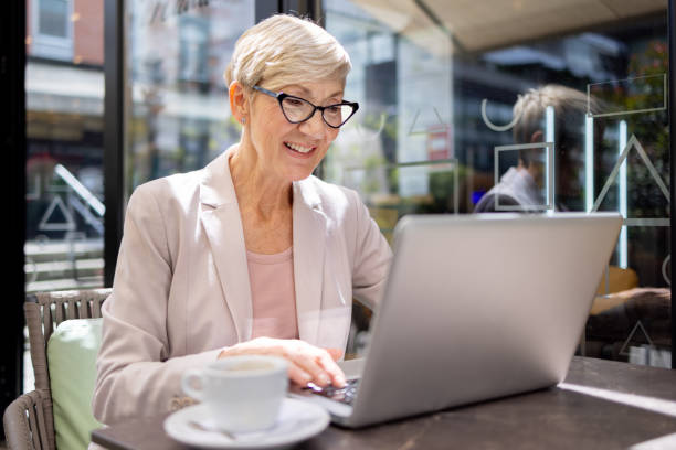 istock Woman working on laptop at cafe table 2177155091
