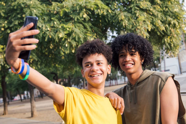 istock two male teens smiling happy taking selfie photo 2177156174