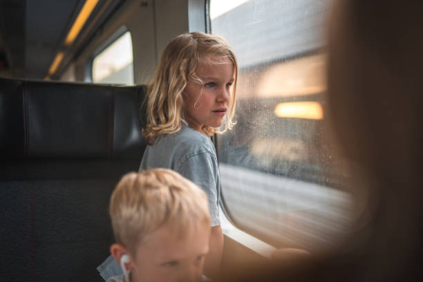 istock Caucasian Boy Observing Scenery on a Train 2177158330
