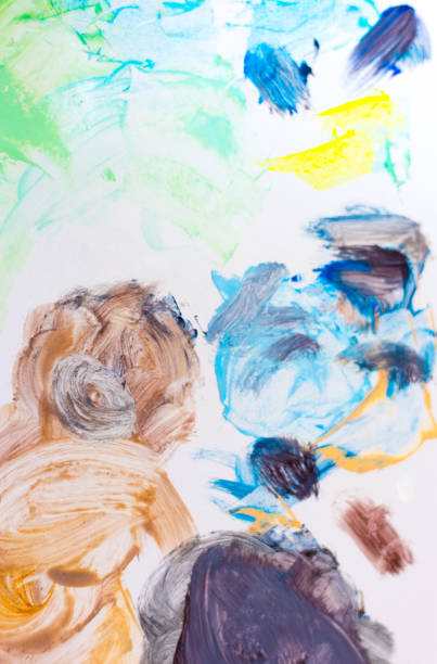 Children of different ages playing with paint and staining clothes and face, carefree and sympathetic.