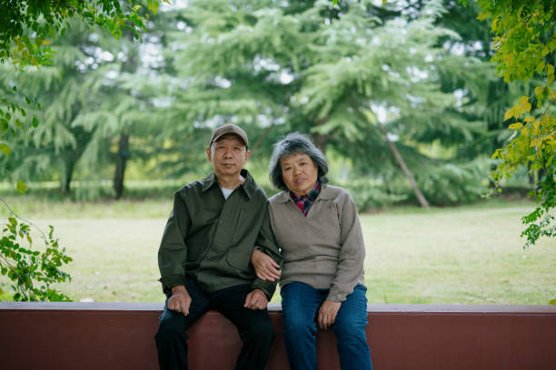 Senior couple walking together in park