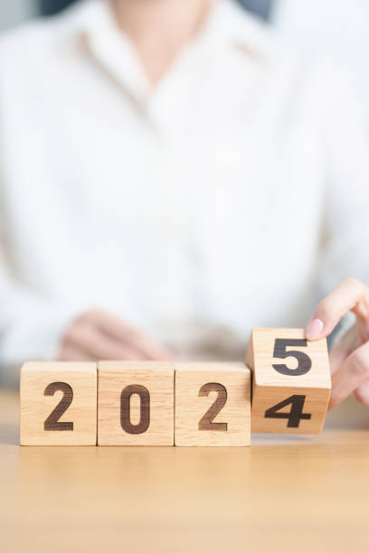 istock 2024 change to 2025 year block on table. goal, Resolution, strategy, plan, start, budget, mission, action, motivation and New Year concepts 2177168093