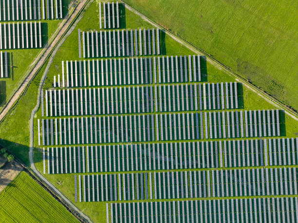 istock Solar panels on field in summer, aerial drone view 2177171090