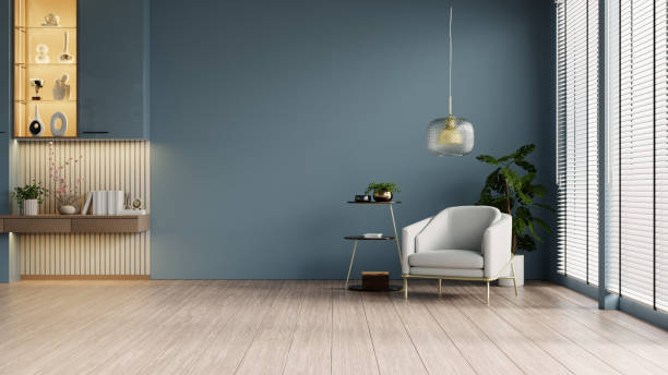 istock Modern minimalist interior with an armchair on empty dark blue wall background- 3D rendering 2177171619