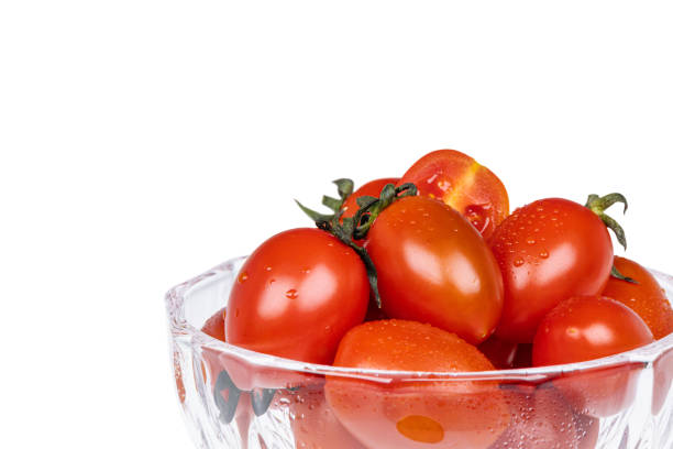 istock The dessert bowl is filled with fresh cherry tomatoes. white background - Solanum lycopersicum var. cerasiforme 2177172585