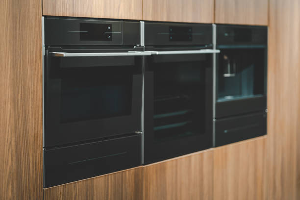 istock A built-in microwave oven with a digital display, seamlessly integrated into a light wooden kitchen cabinet. Built-in microwave oven close-up in the kitchen 2177174413