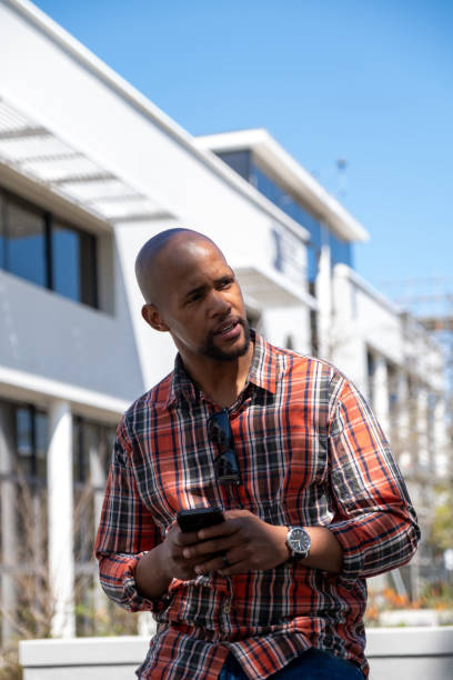 istock Banking on the go using my mobile phone 2177178929