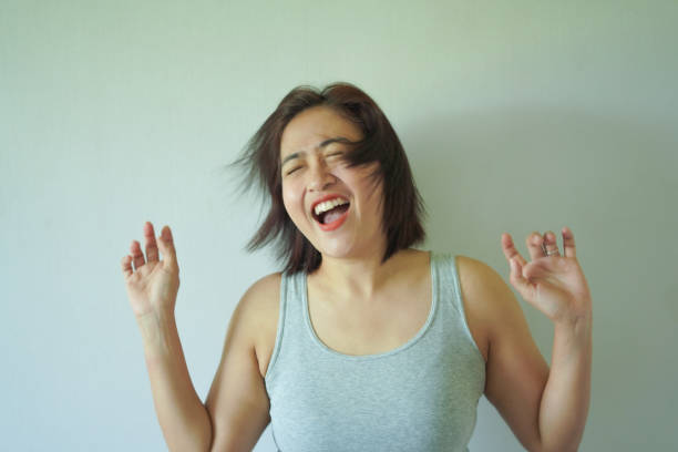Close-up Happy woman on white wall