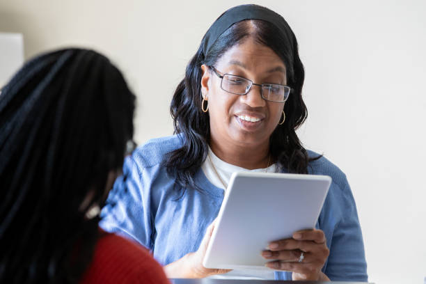 istock Professional young adult woman meets with client in office setting 2177182388