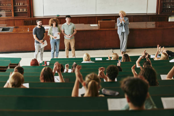 istock Applauding on successful college presentation at lecture hall! 2177186168