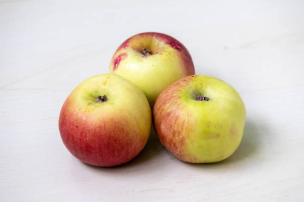 istock Fresh ripe apples on a light wooden surface. 2177186721