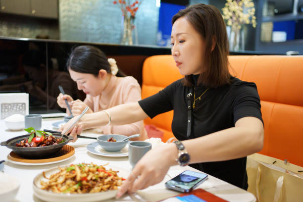 istock Asian woman enjoying dinner 2177187058