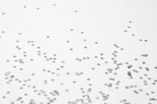 istock sparkles silver stars on white background with text place- Image 2177187092