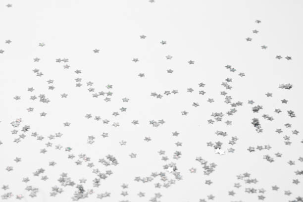istock sparkles silver stars on white background with text place- Image 2177187093
