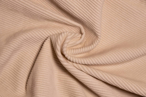 istock Velvety fabric texture pattern. Texture of velvet textile nude color. 2177187331