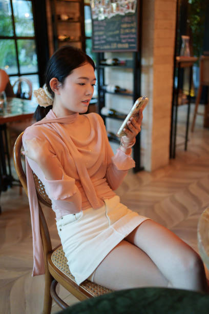 istock Asian girl looking at smartphone 2177187492
