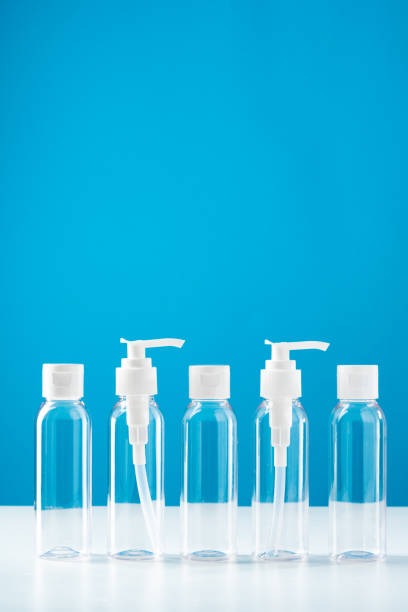 istock Clear plastic bottles with pumps arranged on a table against a bright blue background 2177187642