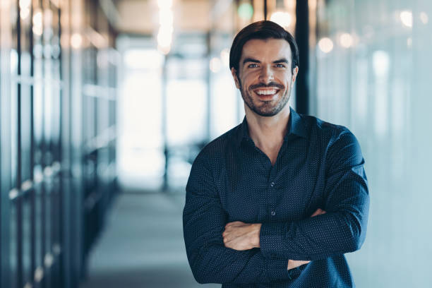 istock Young businessman standing confidently in a modern office space 2177187695