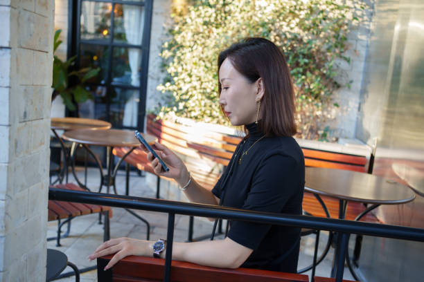 istock Asian woman looking at smartphone 2177187763