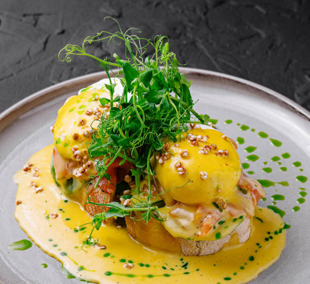 istock Delicious eggs benedict with salmon and herbs on plate, restaurant serving 2177187842