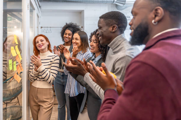 istock Colleagues applauding after a successful meeting in a coworking 2177190810