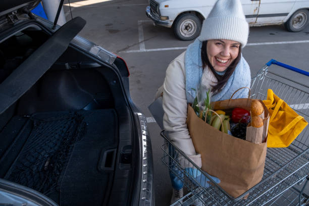 istock Woman uploading Groceries into Car 2177190819